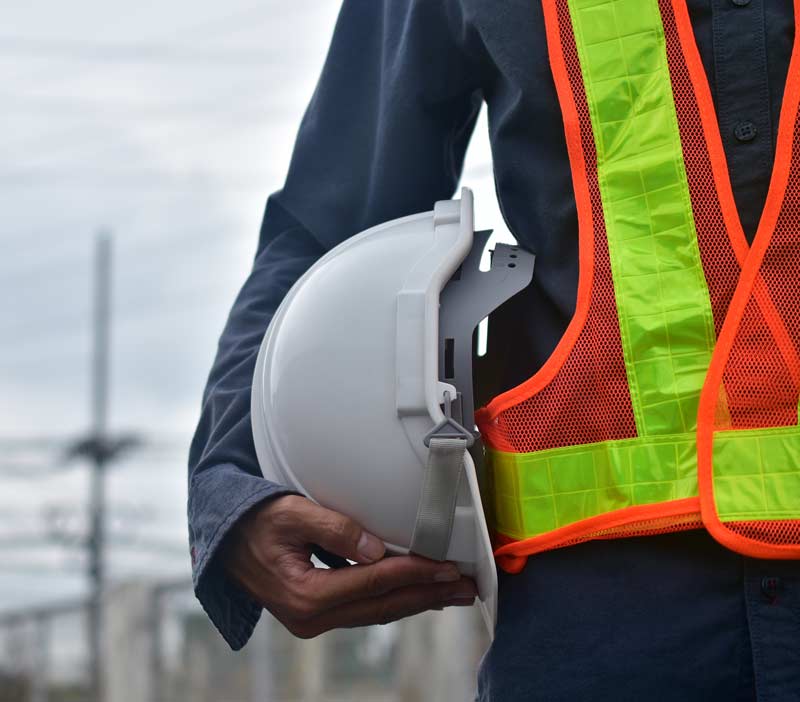 Engineer-Holding-Hard-Hat-Safe